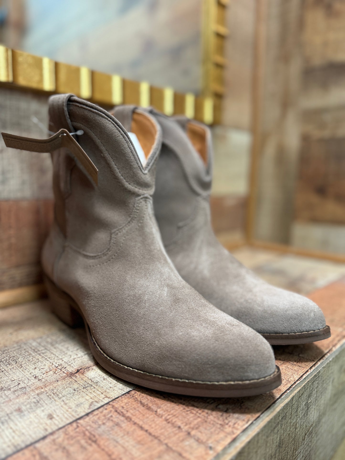 Dingo: Tumbleweed Sand Soft Suede Leather Booties
Cushioned Insole
Rubber TPR Outsole